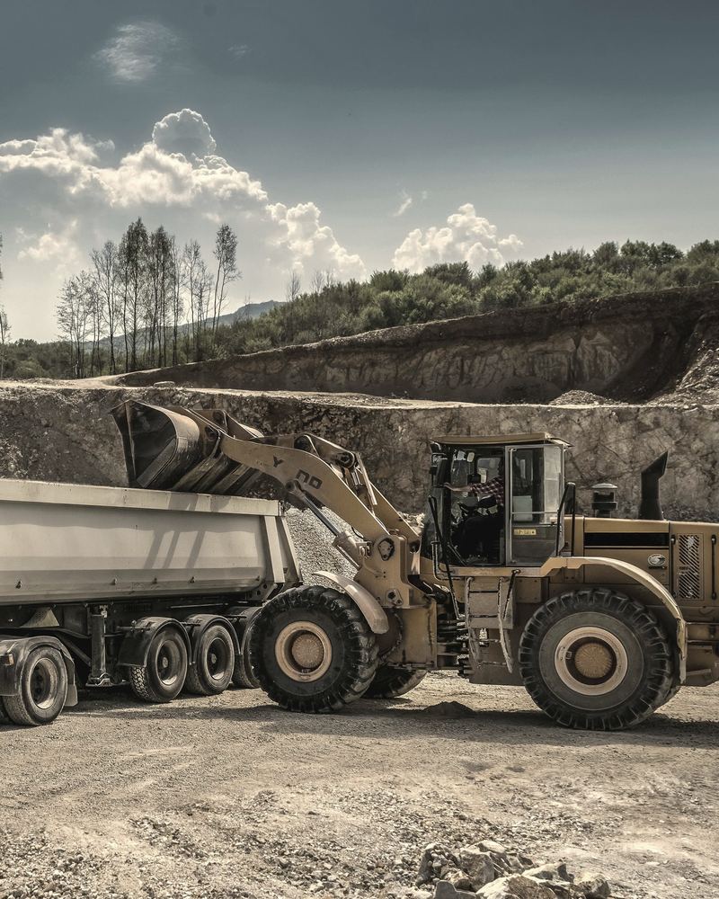 Wheel loader loading a tipper truck in a quarry